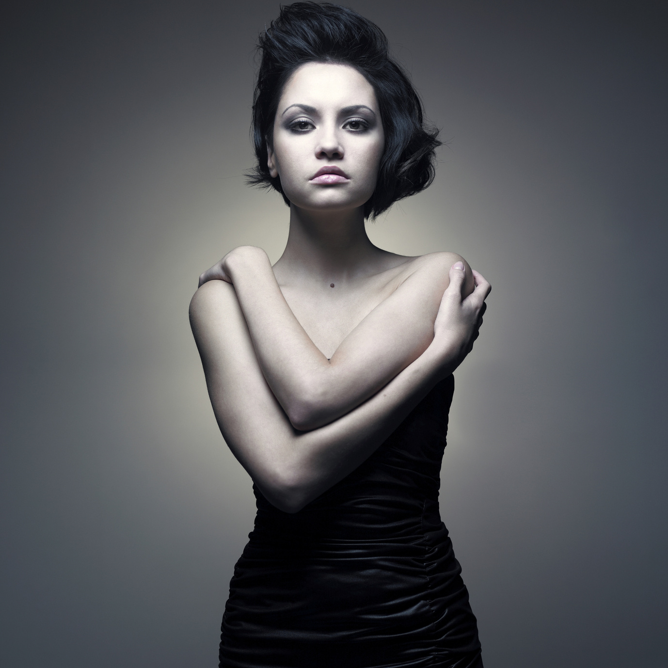 Fashion portrait of young magnificent lady in black dress